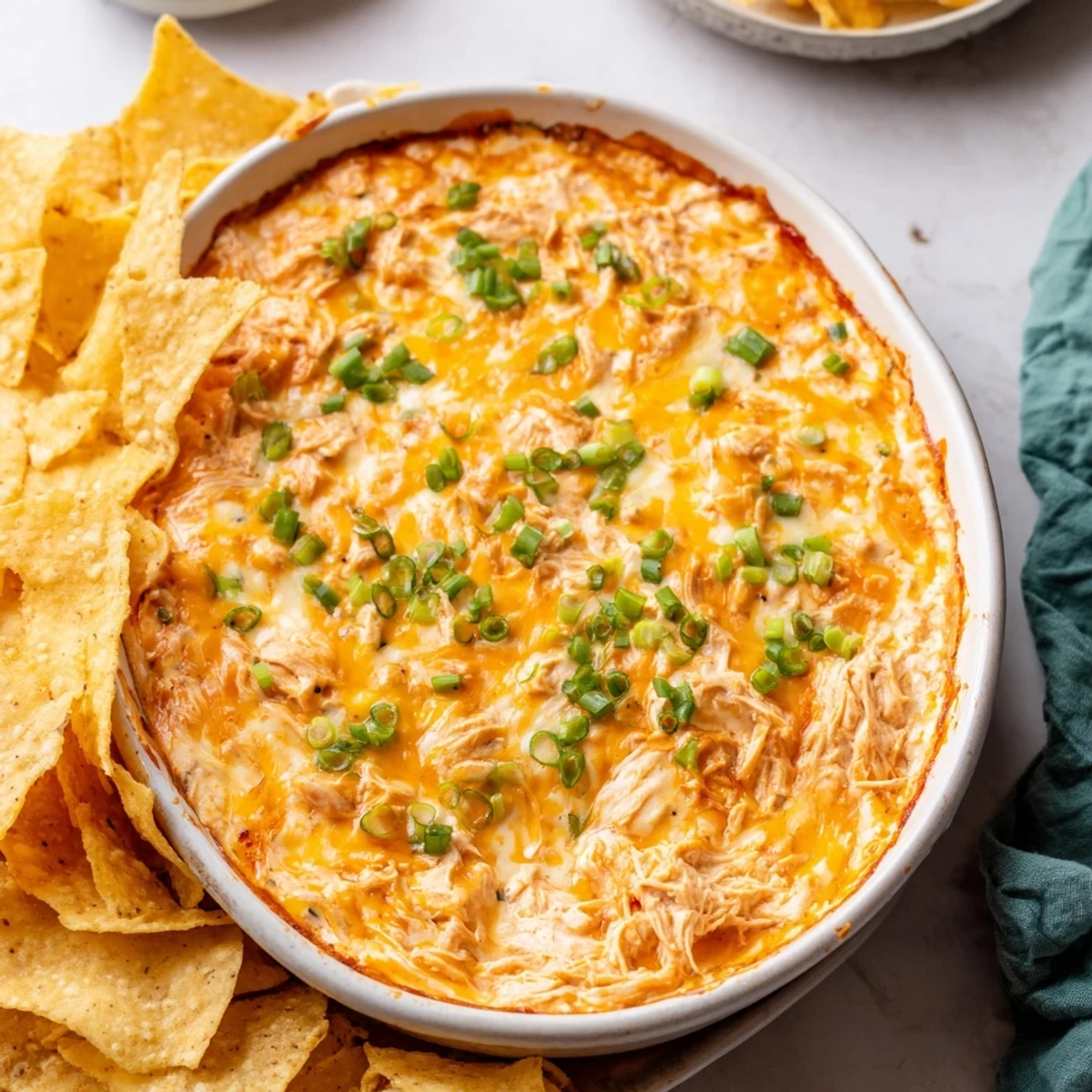 Creamy Spicy Buffalo Chicken Dip, loaded with melted cheese and served hot for a delicious appetizer.