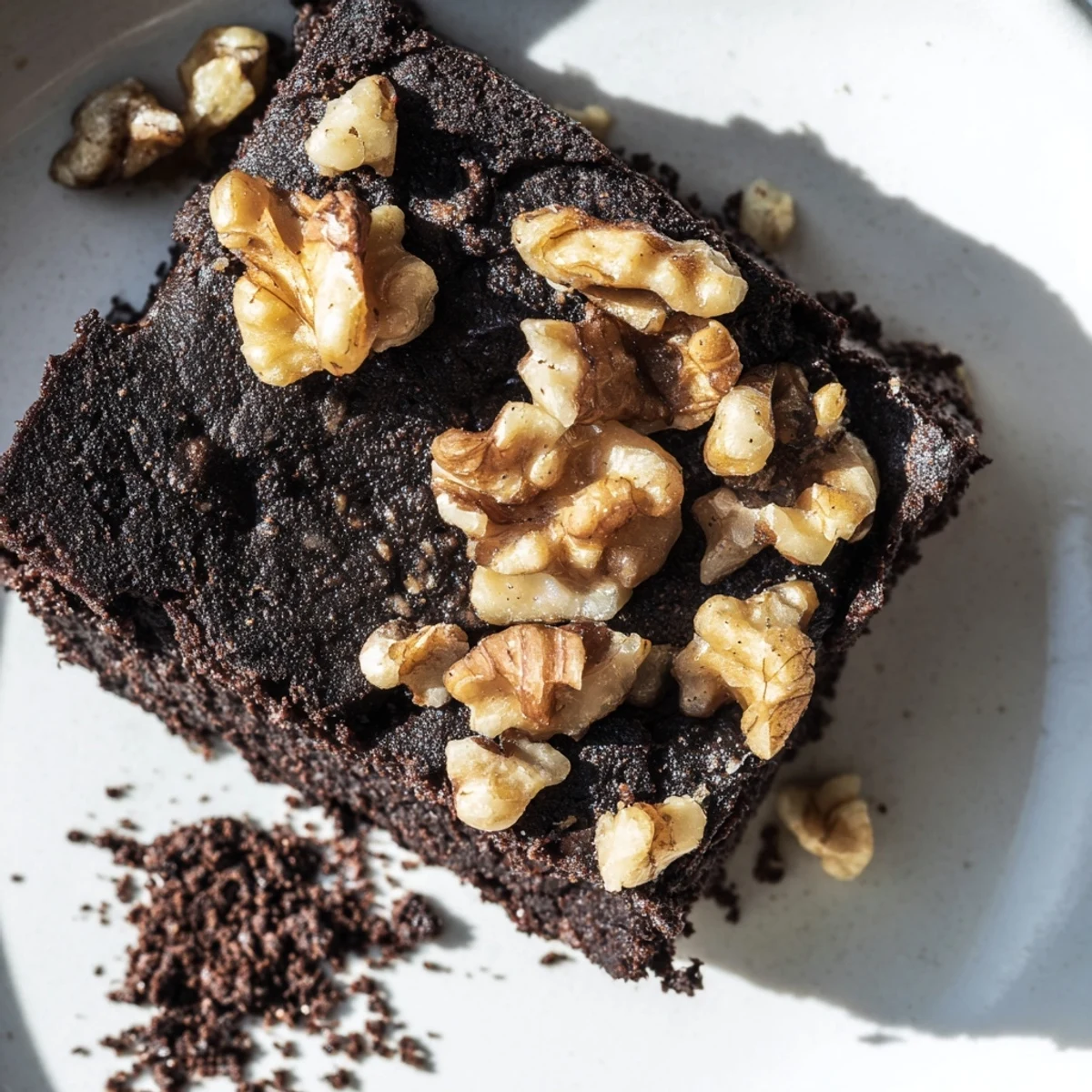 Stack of rich Chocolate Fudge Brownies with Chopped Walnuts on a rustic wooden board.