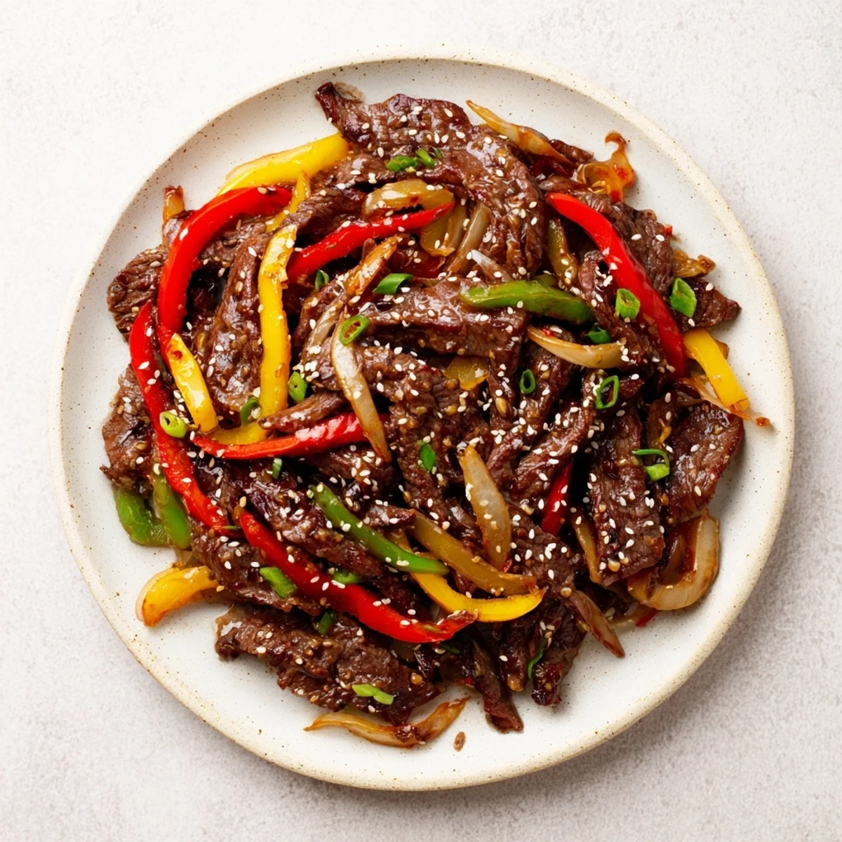 Quick-cooking Spicy Beef and Bell Pepper Stir Fry with crisp-tender vegetables in a bold, glossy sauce.