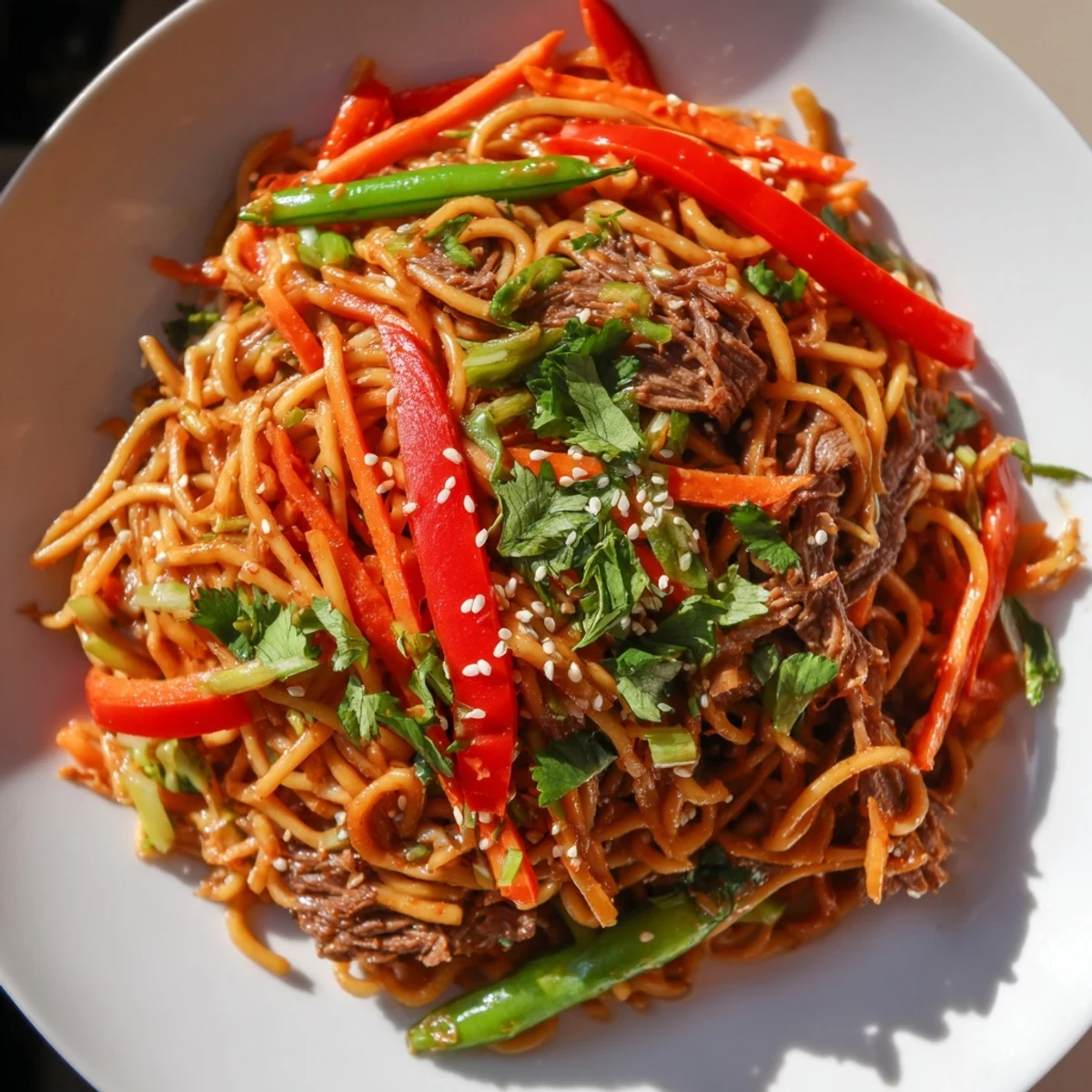 Tender beef strips, crisp veggies, and noodles coated in a glossy sauce for Spicy Beef Noodles with Vegetables.