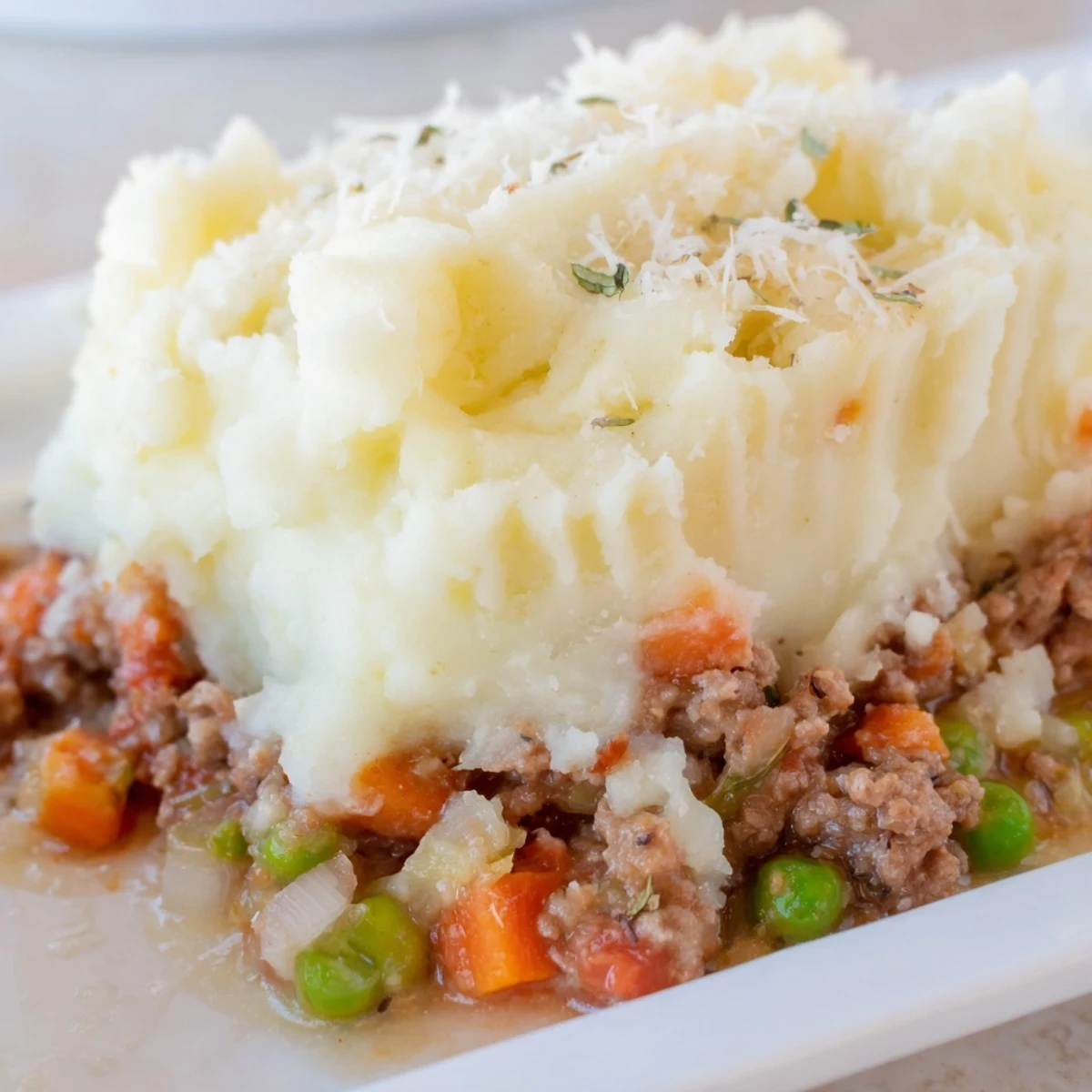 Freshly baked Shepherd's Pie with ground beef and vegetables, featuring a creamy mashed potato topping and a crisp, golden-brown crust.