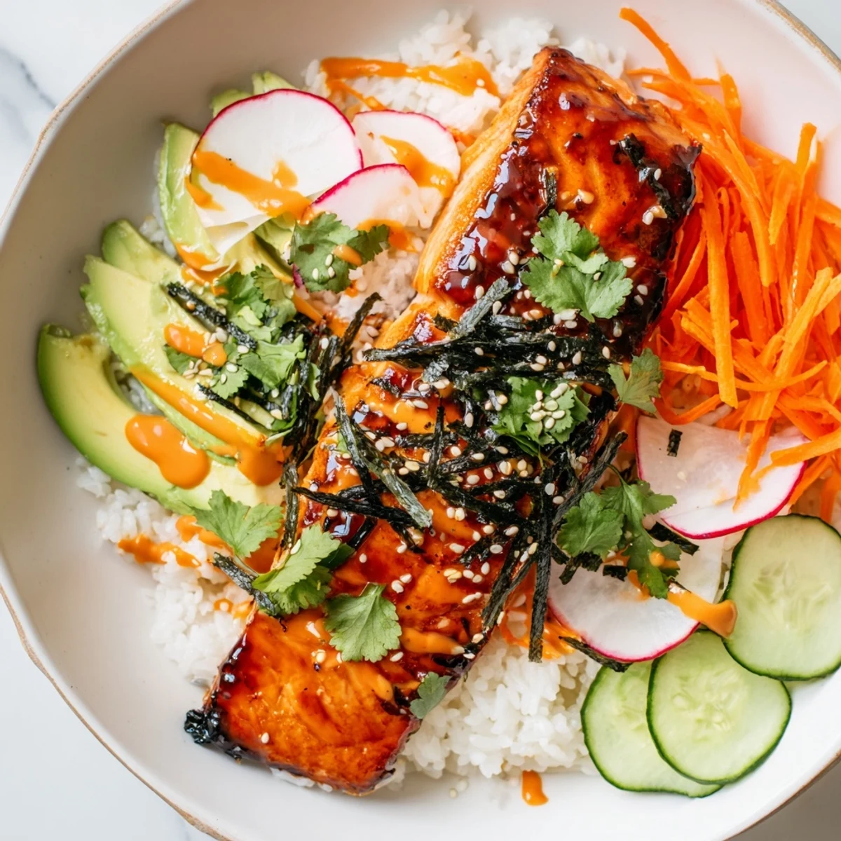 Bright bowls feature toasted sesame seeds, green scallions, and a drizzle of zesty sriracha mayo ready to serve.