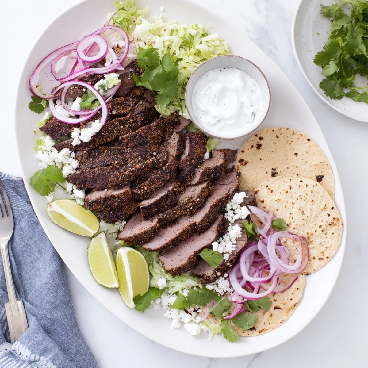 Golden brown roasted leg of lamb, crusted with aromatic cumin and spices, served as sizzling tacos with vibrant garnishes.