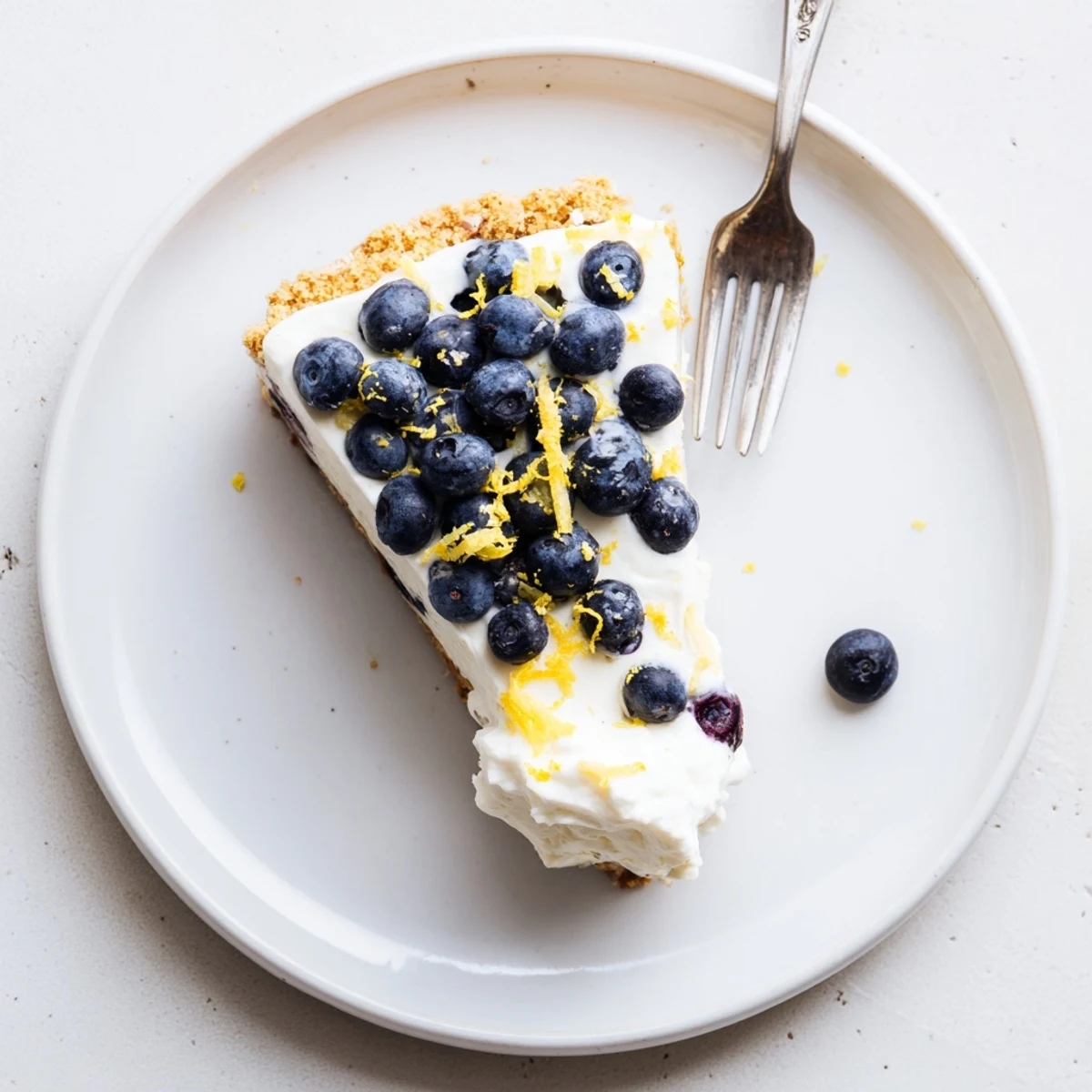 Light and fluffy no bake dessert featuring tangy lemon and sweet blueberry cream filling
