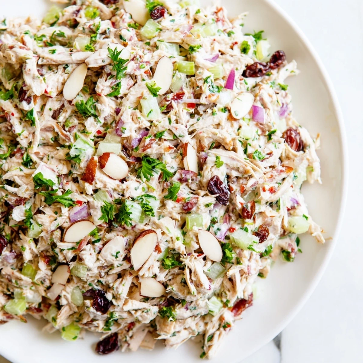 Creamy Greek yogurt rotisserie chicken salad with crisp celery and red bell pepper chunks