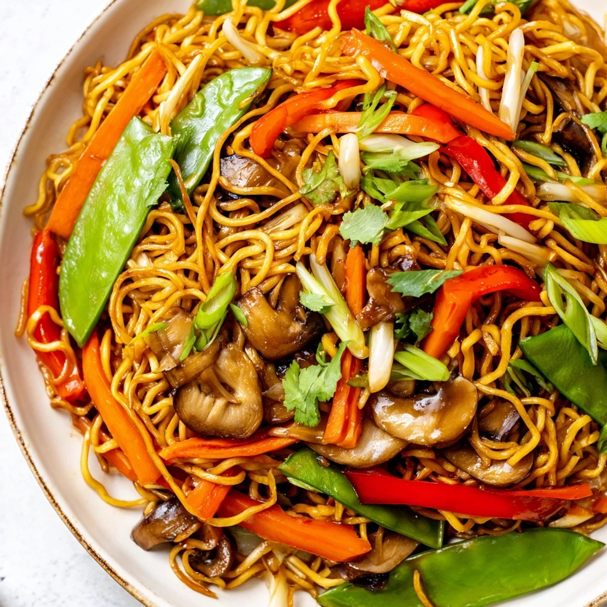 Crispy noodle chow mein with tender bell peppers, carrots, and snow peas in sauce