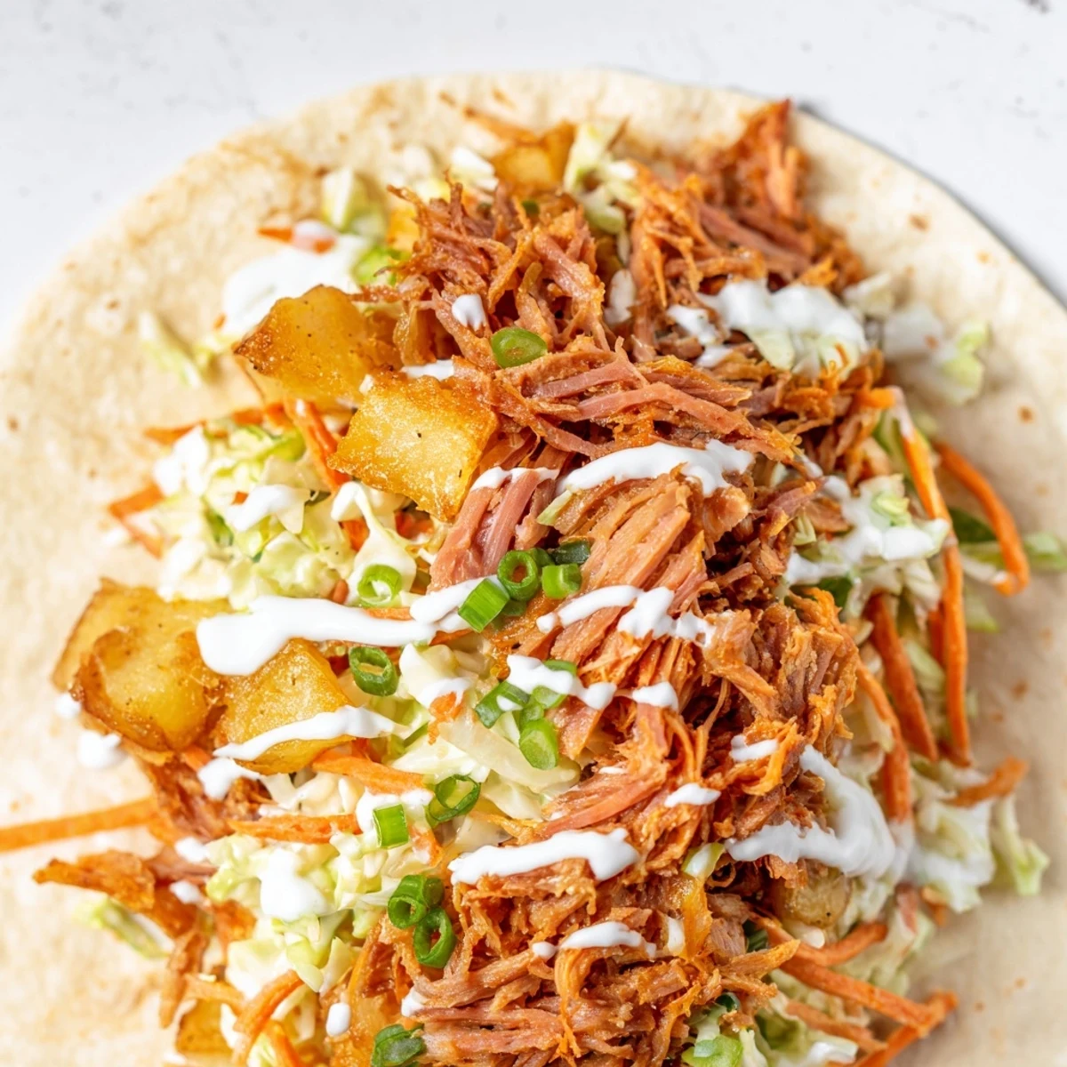 Homemade Irish fusion tacos featuring corned beef, roasted potatoes, and creamy coleslaw in soft tortillas