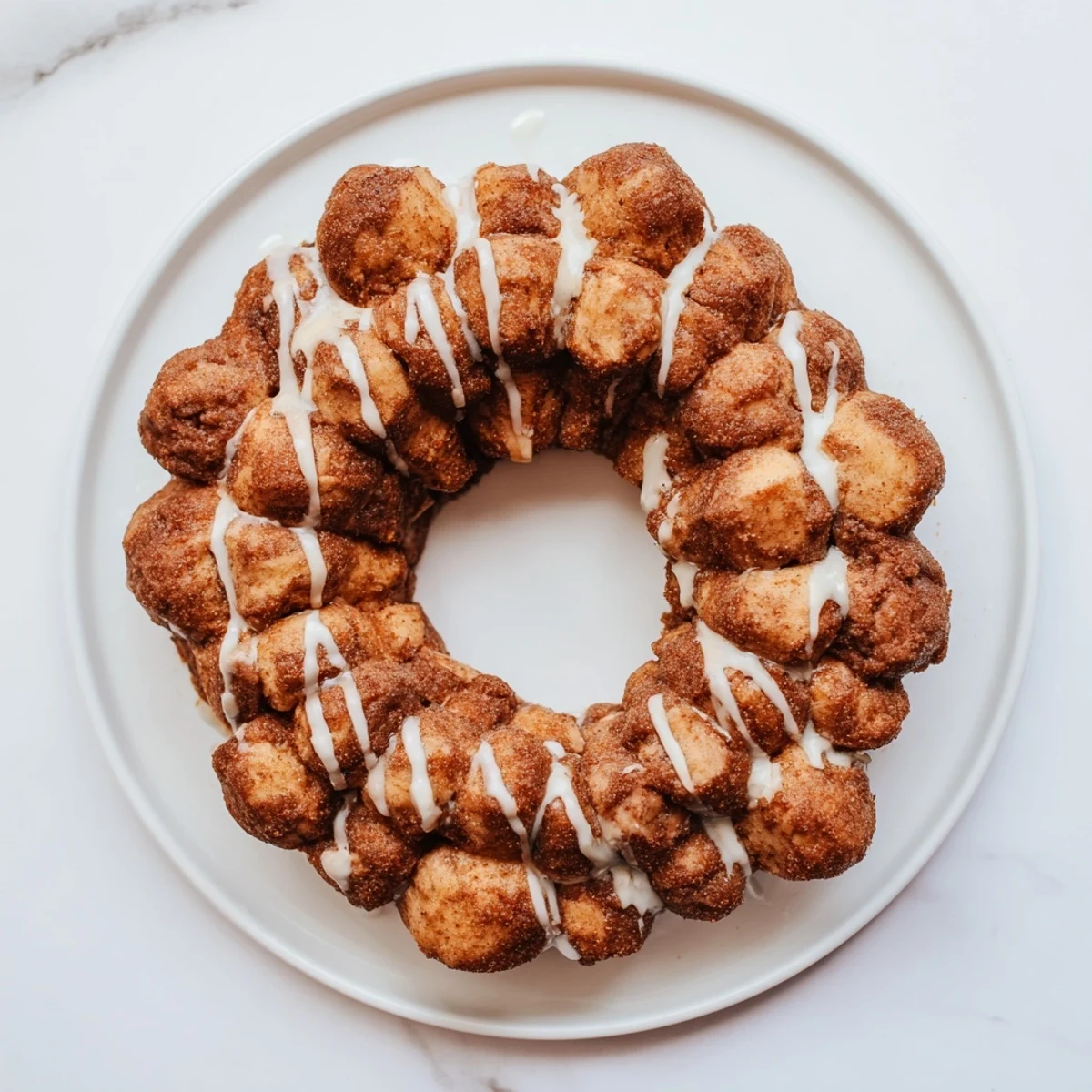 Golden high protein no sugar monkey bread with cinnamon coating in a bundt pan