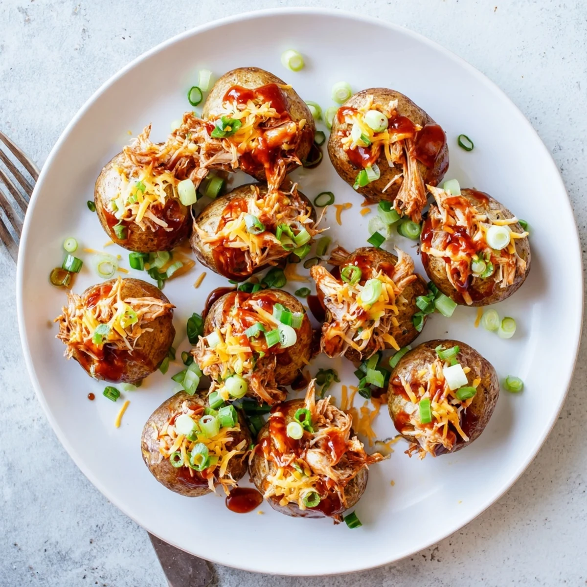 Golden roasted baby potatoes loaded with honey BBQ chicken and melted cheddar cheese