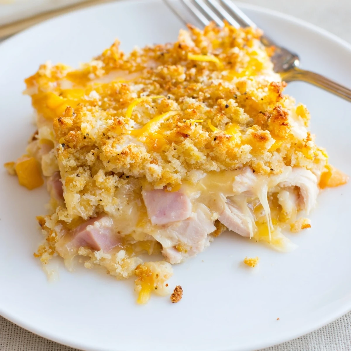 Hearty Chicken Cordon Bleu Casserole sliced, tender chicken and ham, paired with salad
