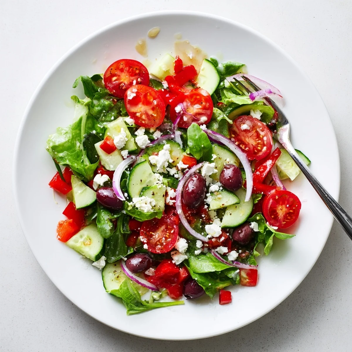 Colorful Fresh Salad Recipe served in a bowl with crunchy cucumbers.