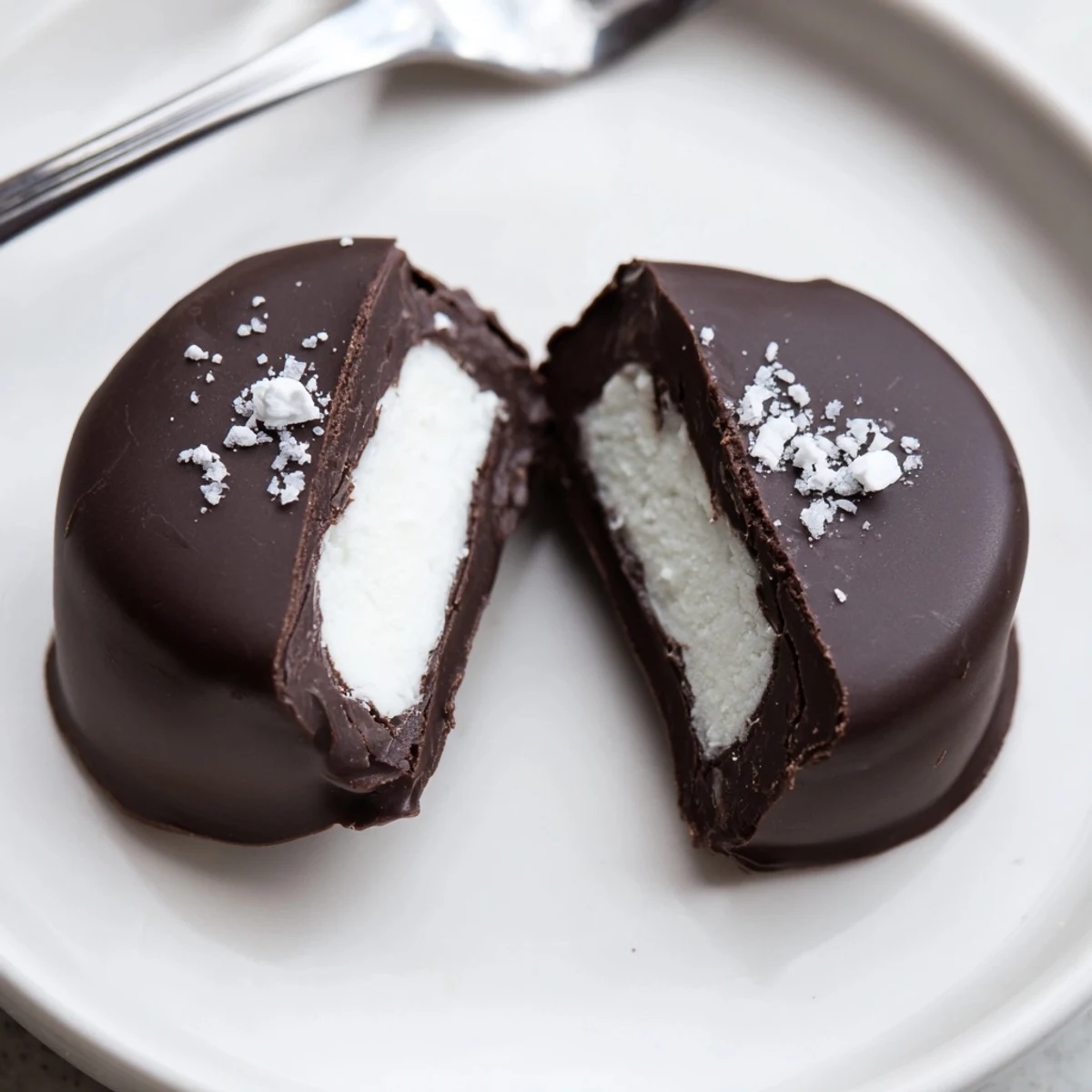 Stacked Peppermint Patties beside a mug, cool mint aroma and shiny sheen