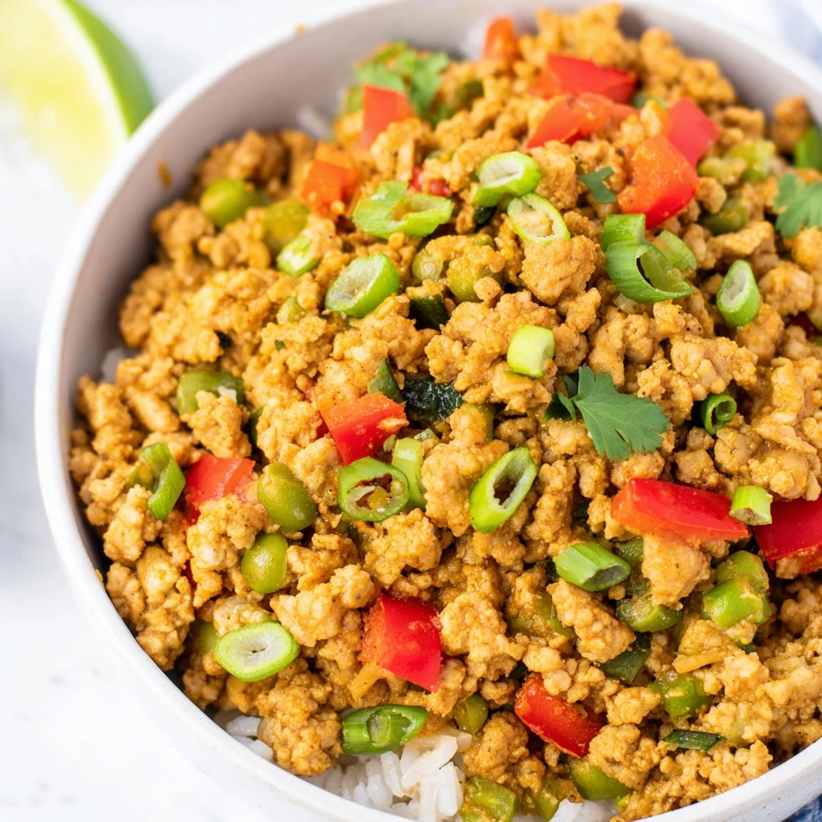 Spiced turkey rice bowls served over fluffy grains with vibrant sautéed vegetables